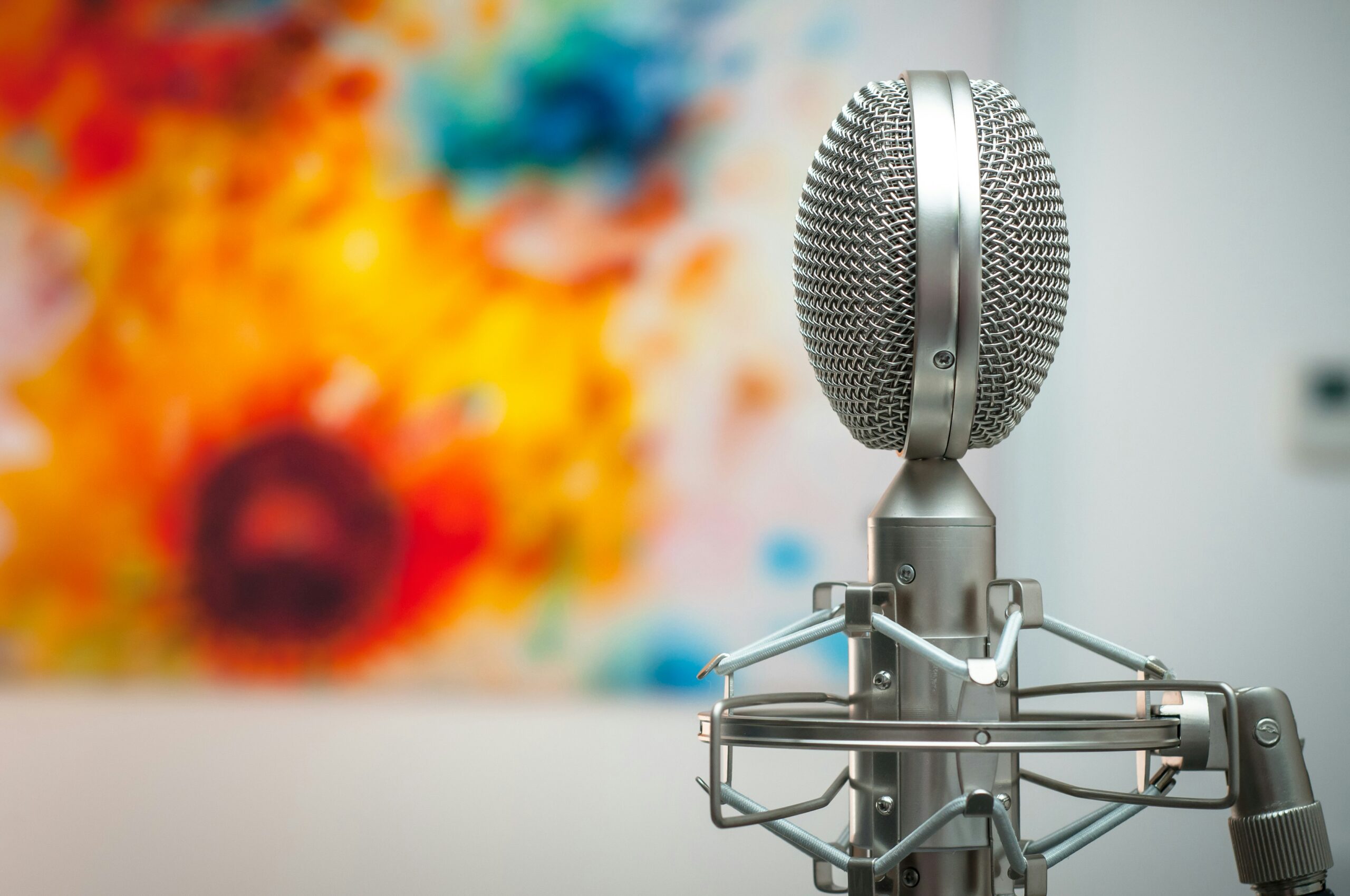 a microphone over a colourful background